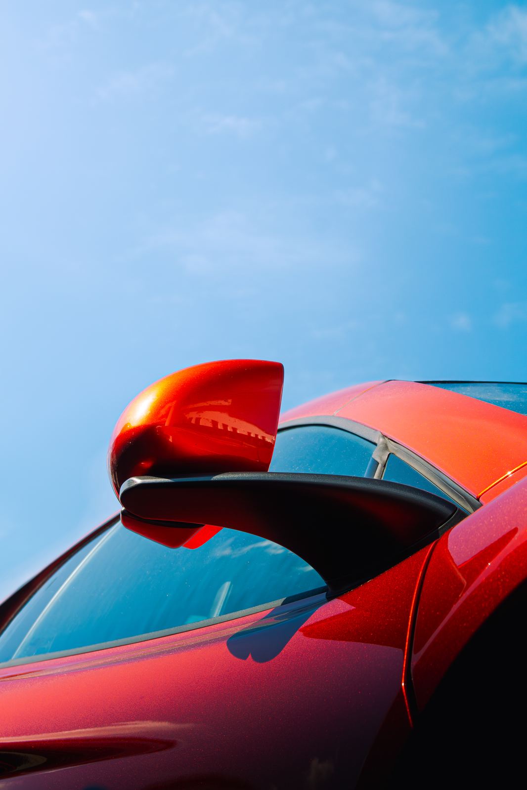 Red mirror and roofline detail